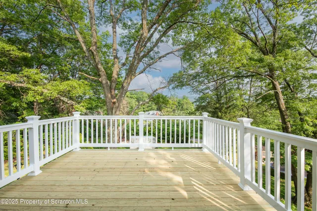 a view of closet with wooden floor