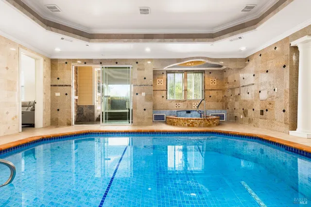 a view of swimming pool with an outdoor space and seating area