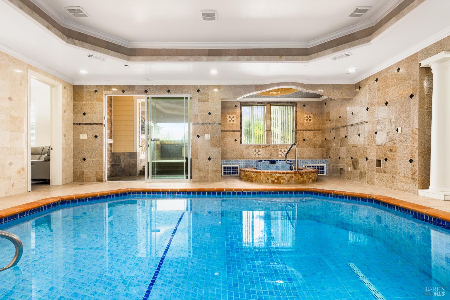 a view of swimming pool with an outdoor space and seating area