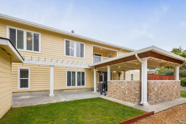 a bedroom with a large bed and a large window