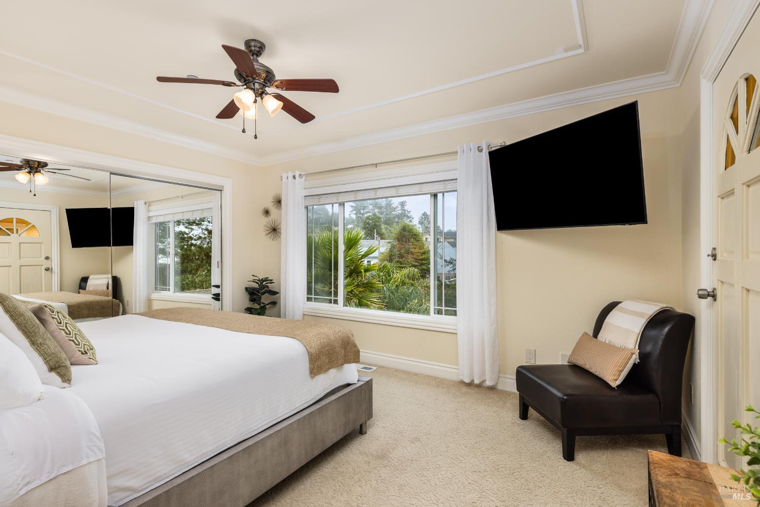 1534 Ranch Road Bodega Bay, CA 94923 - Photo 21 of 33 a bedroom with a bed a flat screen tv and a couch