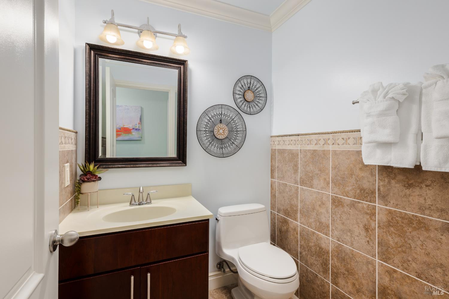 1534 Ranch Road Bodega Bay, CA 94923 - Photo 26 of 33 a bathroom with a toilet sink vanity and mirror