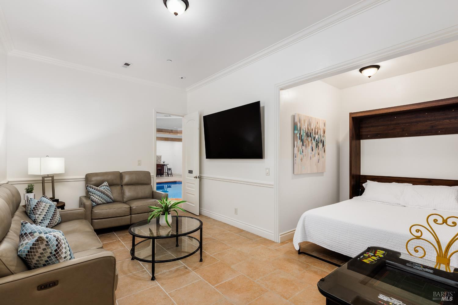 1534 Ranch Road Bodega Bay, CA 94923 - Photo 28 of 33 a living room with furniture and a flat screen tv