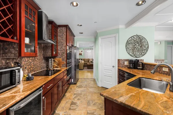 a kitchen that has a lot of cabinets in it