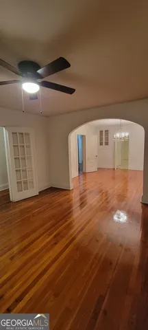 a view of room with wooden floor