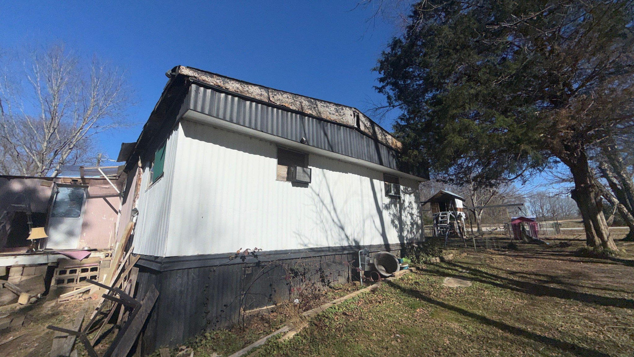 693 Watson Road, Unit SUITE E Jackson, TN 38305 - Photo 3 of 12 a view of a back yard of the house