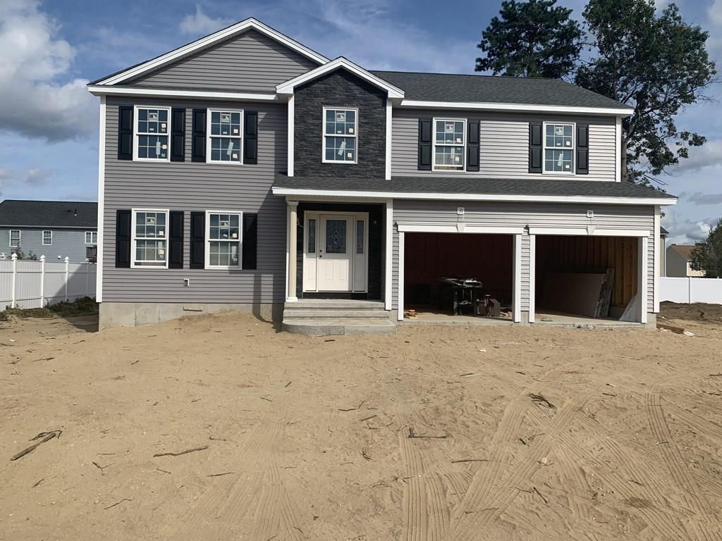 281 Gilbert Avenue Springfield, MA 01119 - Photo 1 of 31 a front view of a house with a yard and garage