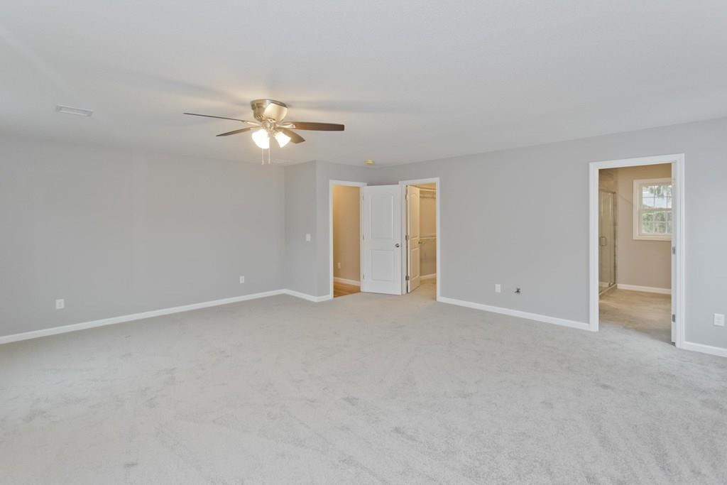 281 Gilbert Avenue Springfield, MA 01119 - Photo 17 of 31 a view of a room with a ceiling fan and a chandelier fan