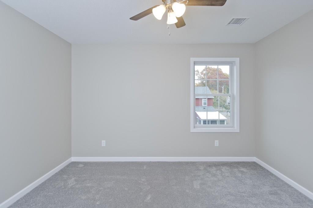 281 Gilbert Avenue Springfield, MA 01119 - Photo 26 of 31 an empty room with a chandelier fan