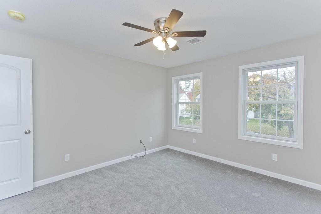 281 Gilbert Avenue Springfield, MA 01119 - Photo 28 of 31 an empty room with a window and a fan