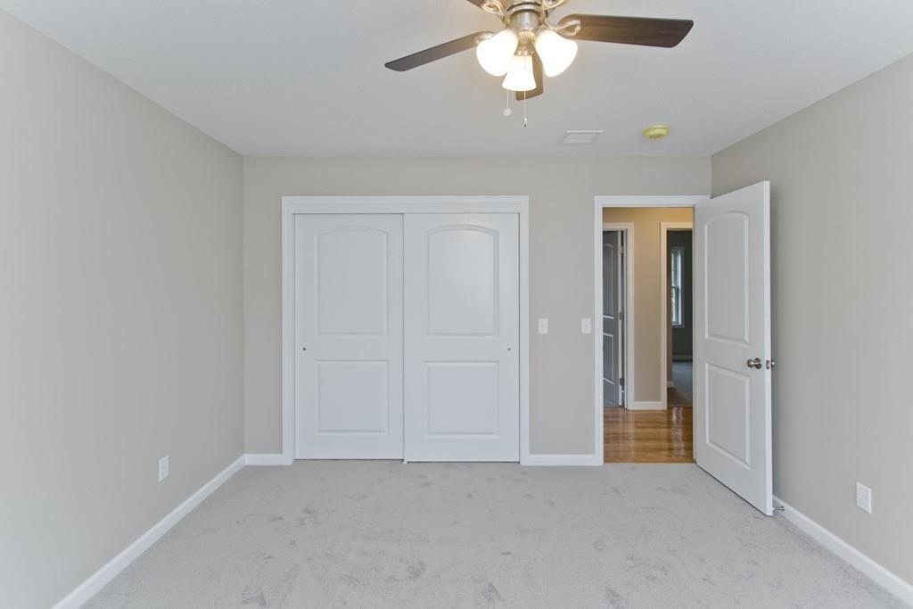 281 Gilbert Avenue Springfield, MA 01119 - Photo 29 of 31 an empty room with a chandelier fan