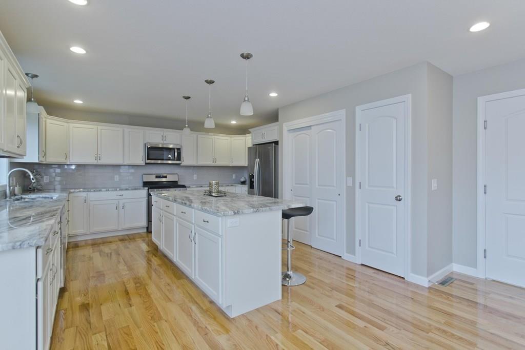 281 Gilbert Avenue Springfield, MA 01119 - Photo 6 of 31 a large kitchen with stainless steel appliances granite countertop a stove a sink and a refrigerator