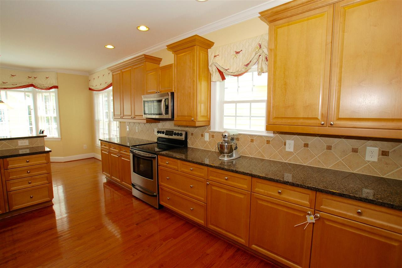 1228 North Blount Street Raleigh, NC 27604 - Photo 8 of 25 More great counter top and cabinet space. Transom window allows for ample natural light. There is also a gas line installed ready for a gas range. Kitchen