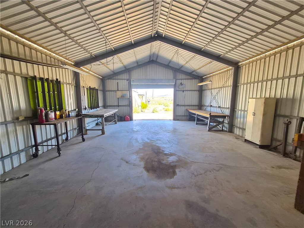 11545 South Spring Meadows Road Pahrump, NV 89060 - Photo 25 of 33 This spacious metal building offers versatile space, perfect for various needs and ample storage.