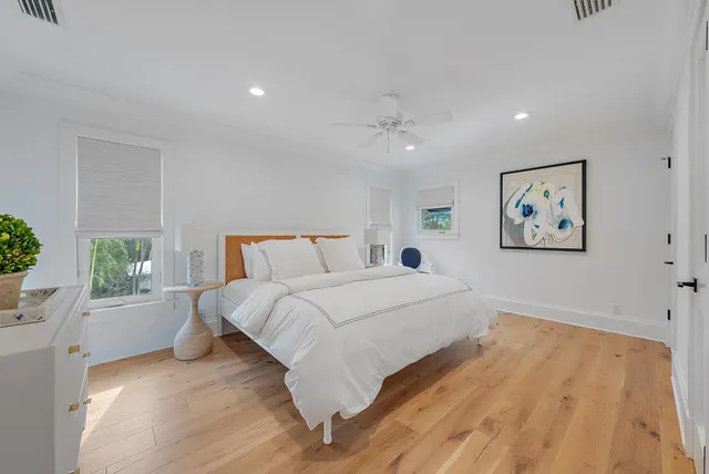 a spacious bedroom with a large bed and a window