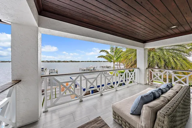 a view of a balcony with furniture