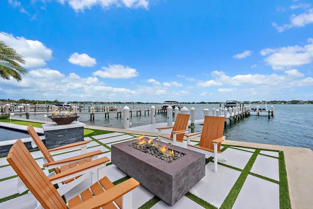 a view of a lake with houses in the back