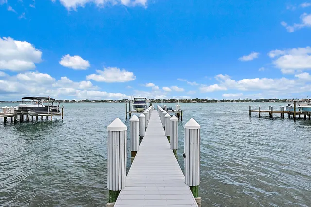 a front view of a house with swimming pool and sitting area