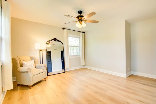 a view of living room with furniture and chandelier