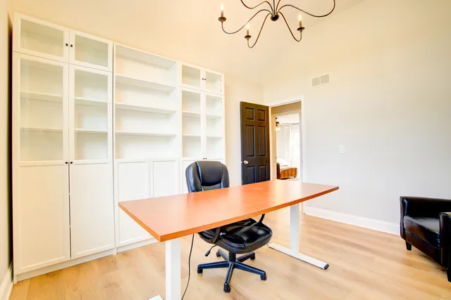 a view of a workspace with furniture