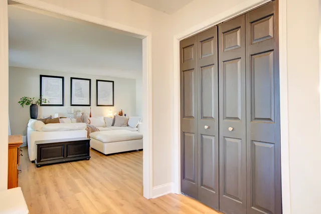 a living room with furniture and a lamp