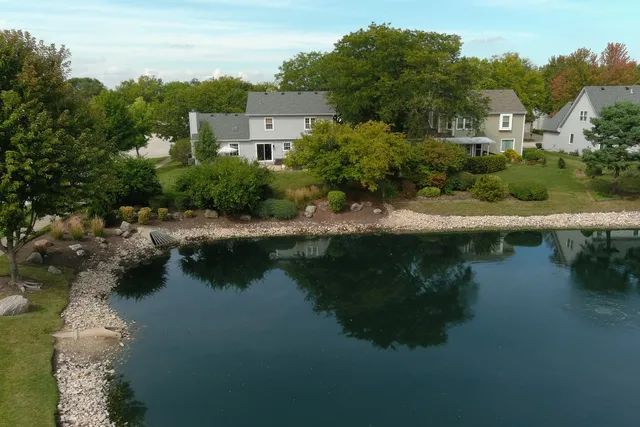 a view of a lake with a house in the background