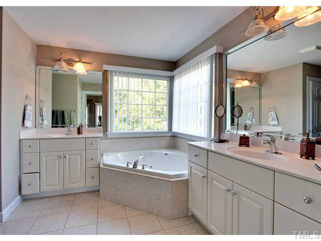 4617 Mentone Way Raleigh, NC 27612 - Photo 14 of 23 Master suite boasts his and hers vanities, whirlpool tub, and separate shower. Master Bath/Spa