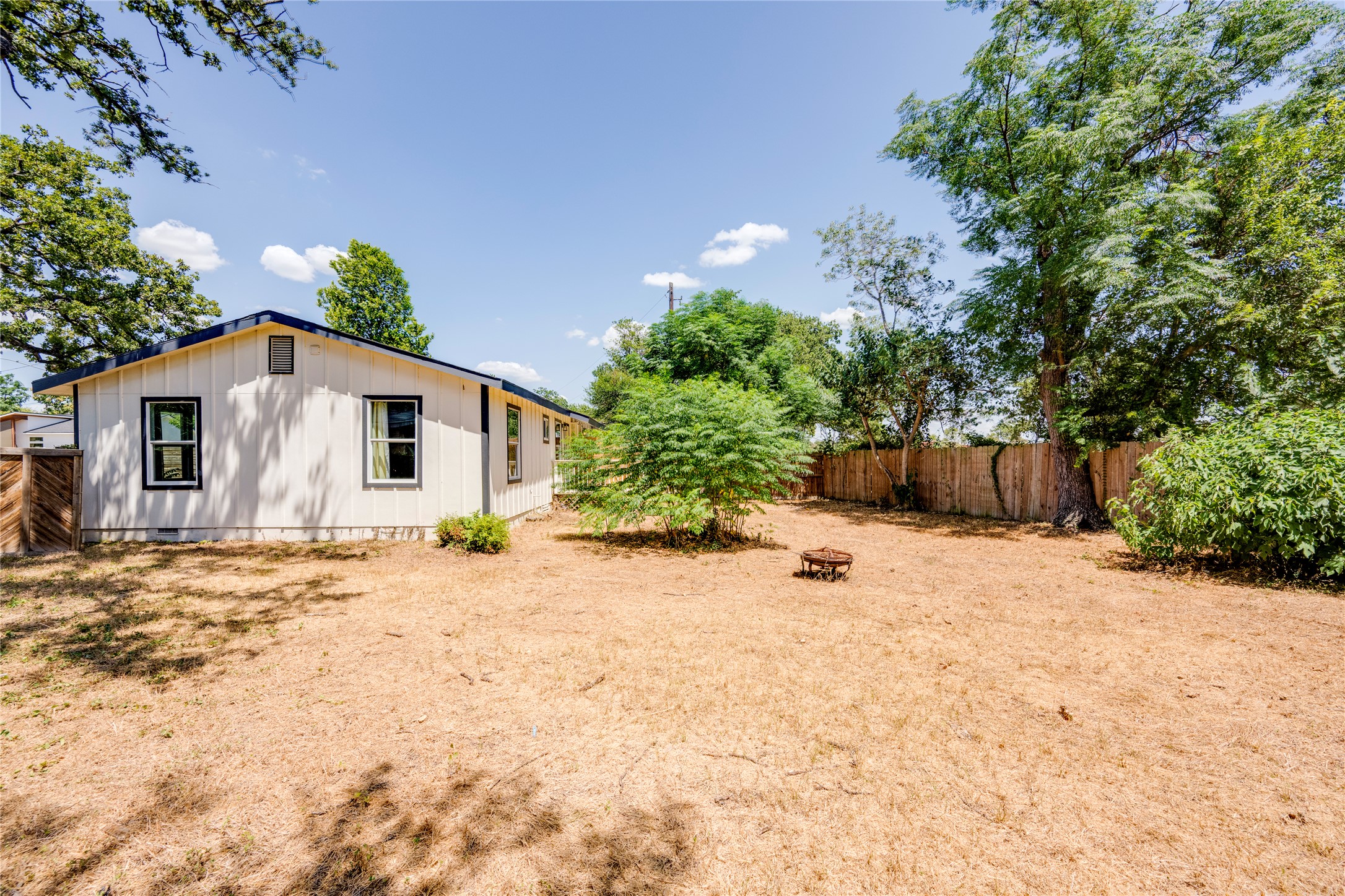 1400 Marcus Place, Unit B Austin, TX 78721 - Photo 37 of 39 A spacious backyard with mature trees provides ample room for outdoor activities and relaxation.