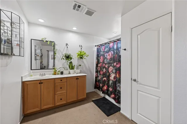 a bathroom with a double vanity sink and a mirror