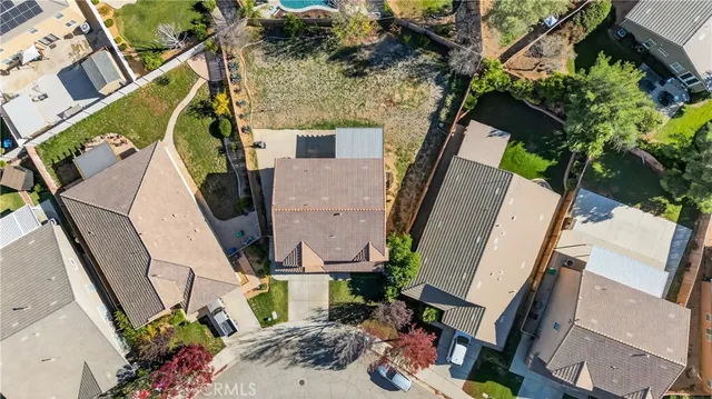 an aerial view of a house with outdoor space