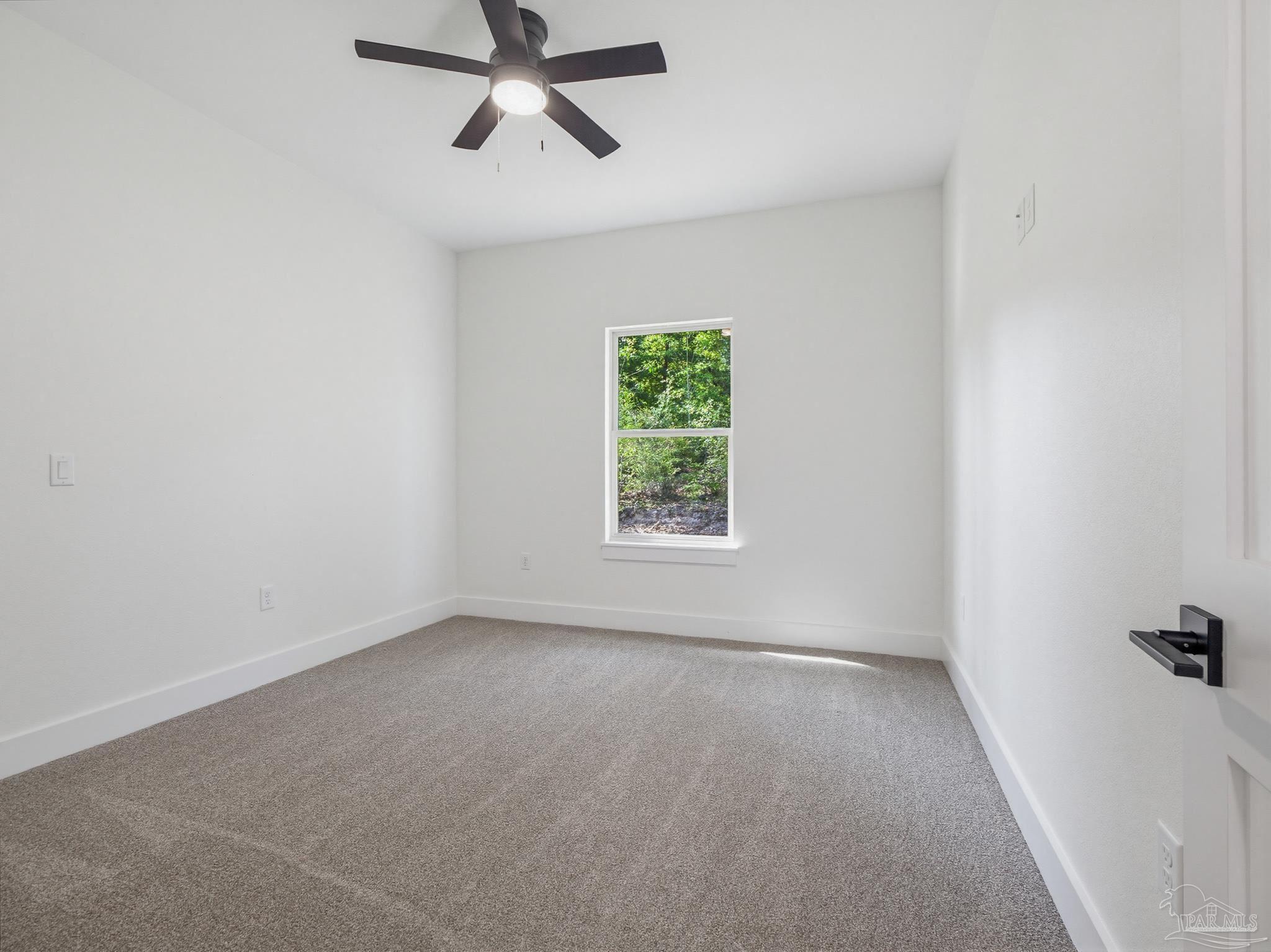 5724 Riviera Drive Milton, FL 32583 - Photo 42 of 52 an empty room with windows