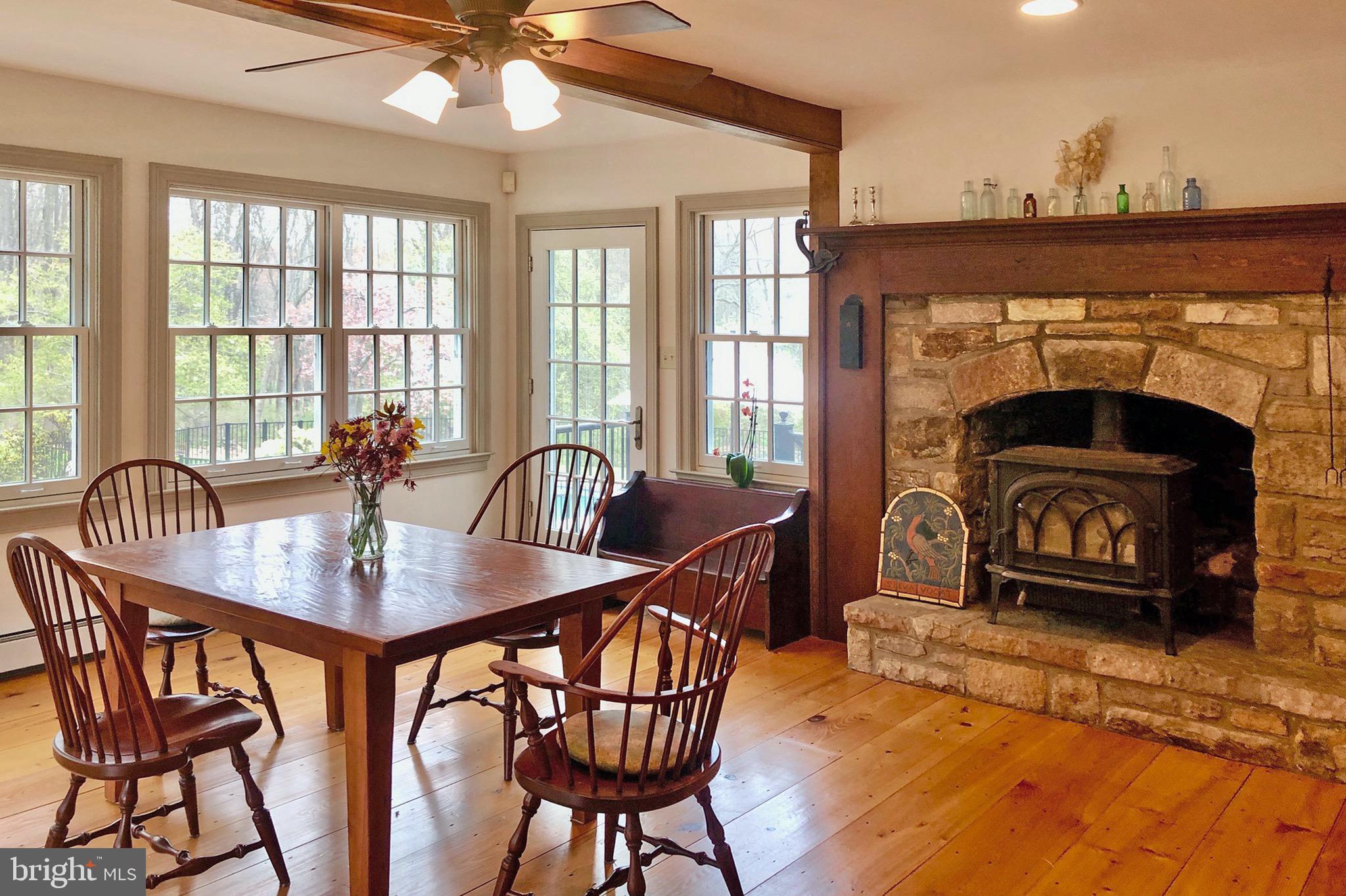 76 Pine Valley Road Doylestown, PA 18901 - Photo 7 of 39 Kitchen has stone fireplace and wall of windows