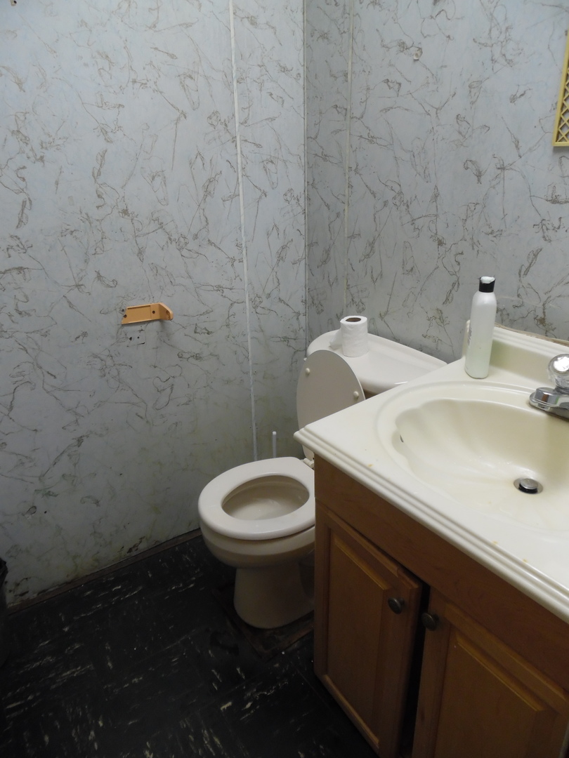 2712 West Division Street Chicago, IL 60622 - Photo 7 of 8 a bathroom with a sink and toilet