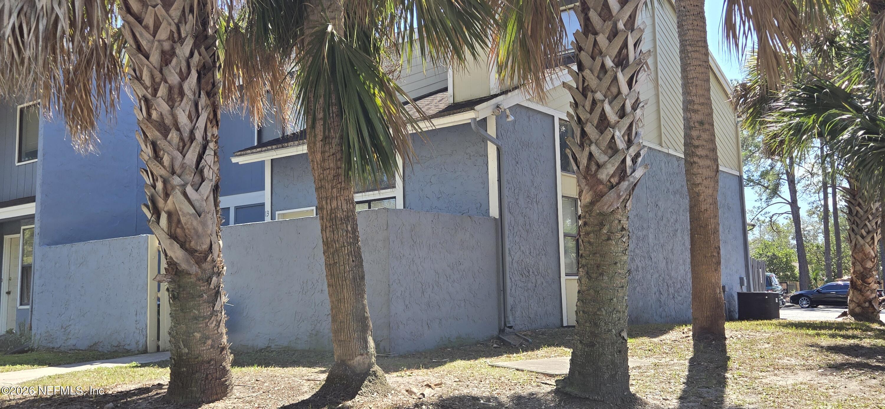 3517 Peeler Road, Unit 13 Jacksonville, FL 32277 - Photo 35 of 38 a view of a balcony with a tree
