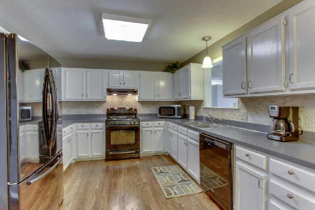 2612 Call Hill Road Nashville, TN 37211 - Photo 6 of 20 Fresh painted cabinets, new tile backsplash, dishwasher, and hardwoods.