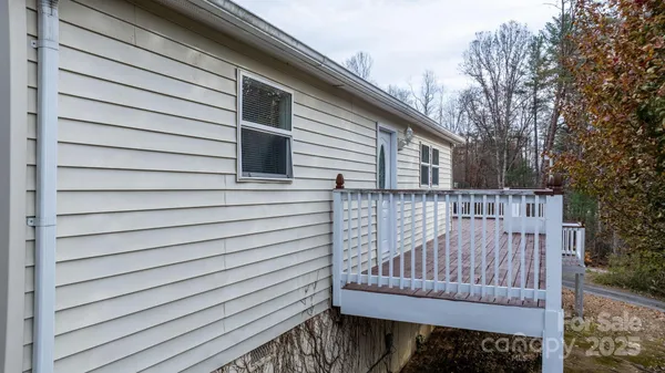 a view of a house with wooden fence