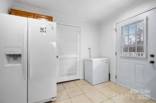 a utility room with cabinets washer and dryer
