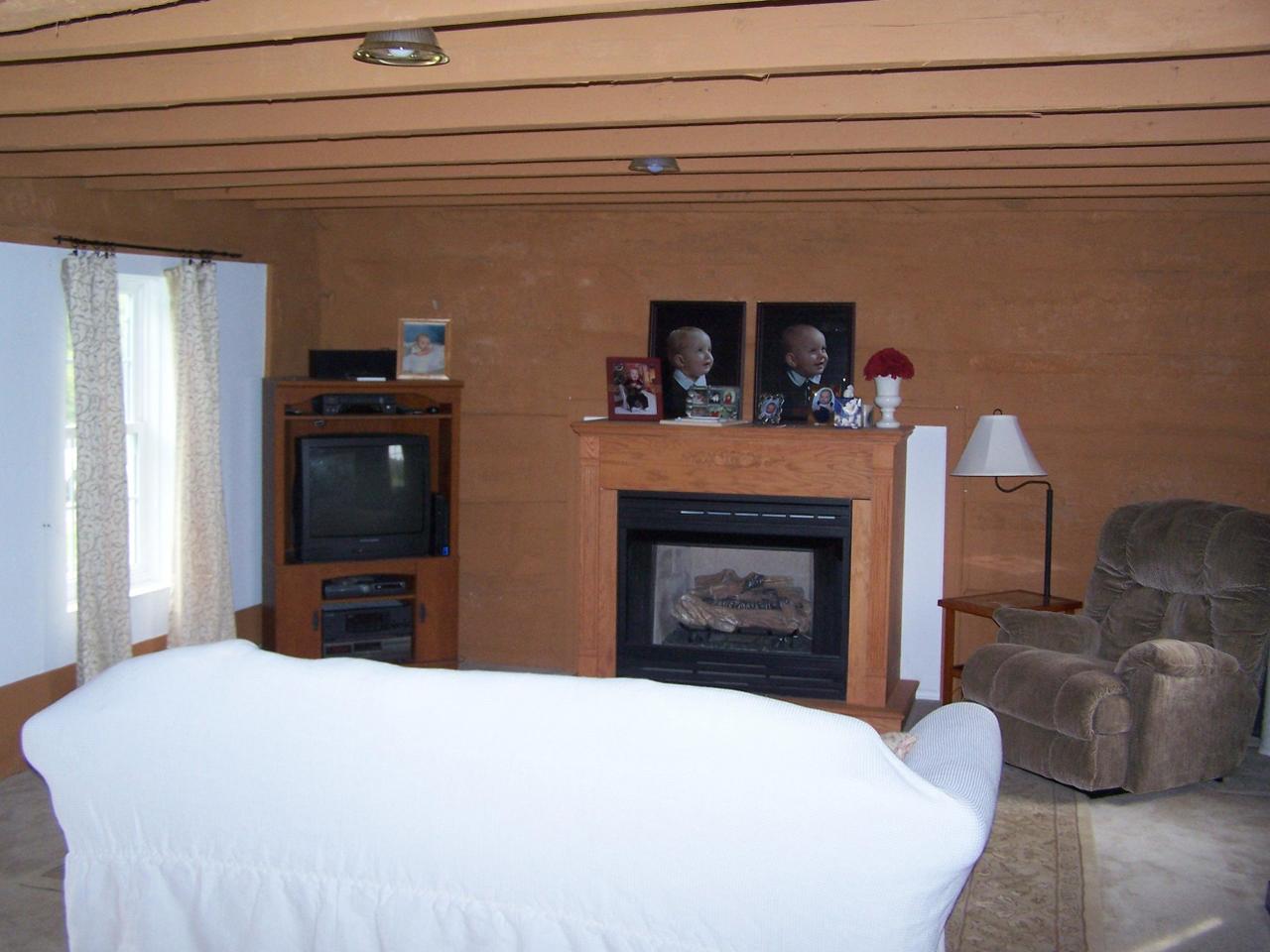 4725 Horseshoe Bend Road Goodview, VA 24095 - Photo 3 of 9 a bedroom with a bed and a fireplace