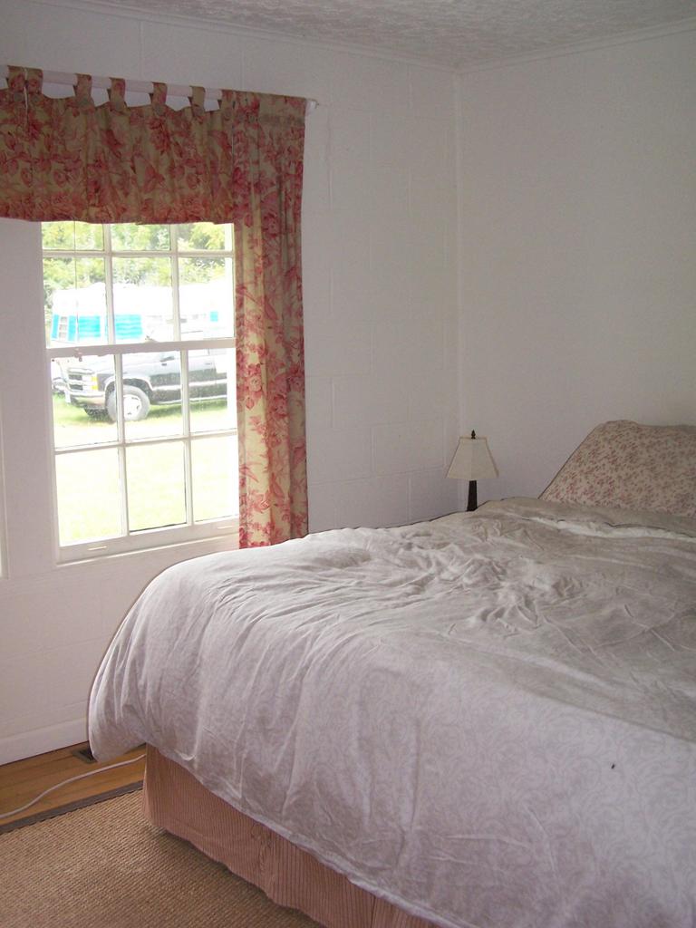 4725 Horseshoe Bend Road Goodview, VA 24095 - Photo 5 of 9 a bedroom with a bed and a window