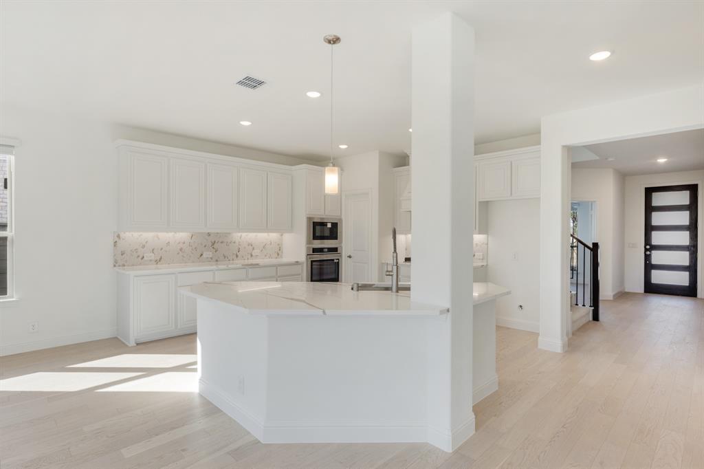 7308 Iris Road Aubrey, TX 76227 - Photo 13 of 40 a view of a kitchen with a sink