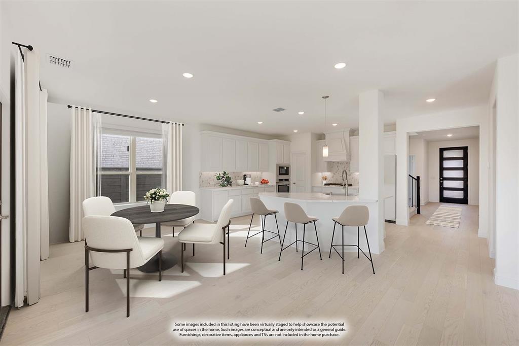 7308 Iris Road Aubrey, TX 76227 - Photo 15 of 40 a living room with lots of furniture and a large window