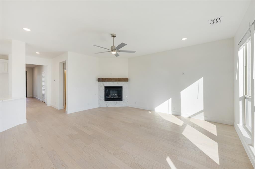 7308 Iris Road Aubrey, TX 76227 - Photo 18 of 40 a view of an empty room with a window