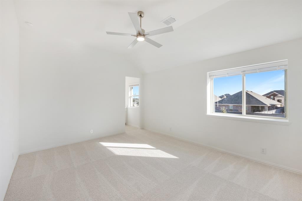 7308 Iris Road Aubrey, TX 76227 - Photo 31 of 40 an empty room with windows and fan