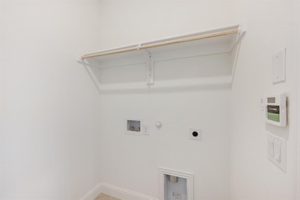 7308 Iris Road Aubrey, TX 76227 - Photo 36 of 40 a view of an empty walk in closet