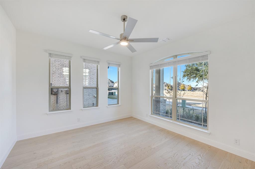 7308 Iris Road Aubrey, TX 76227 - Photo 6 of 40 a view of an empty room with a window