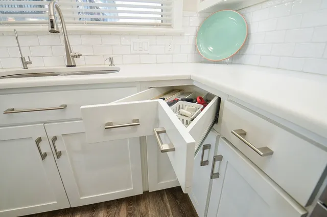 a view of kitchen with furniture and wooden floor