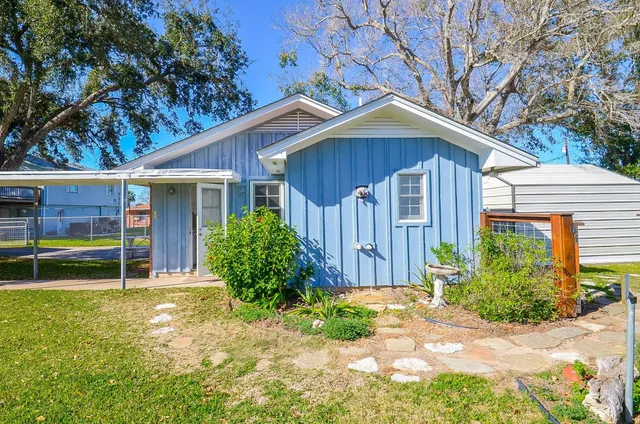 a room with furniture a rug and a window
