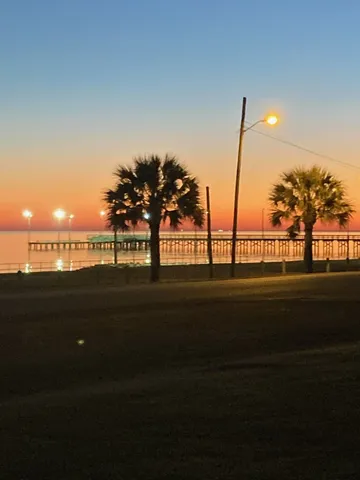 a front view of a house with outdoor seating
