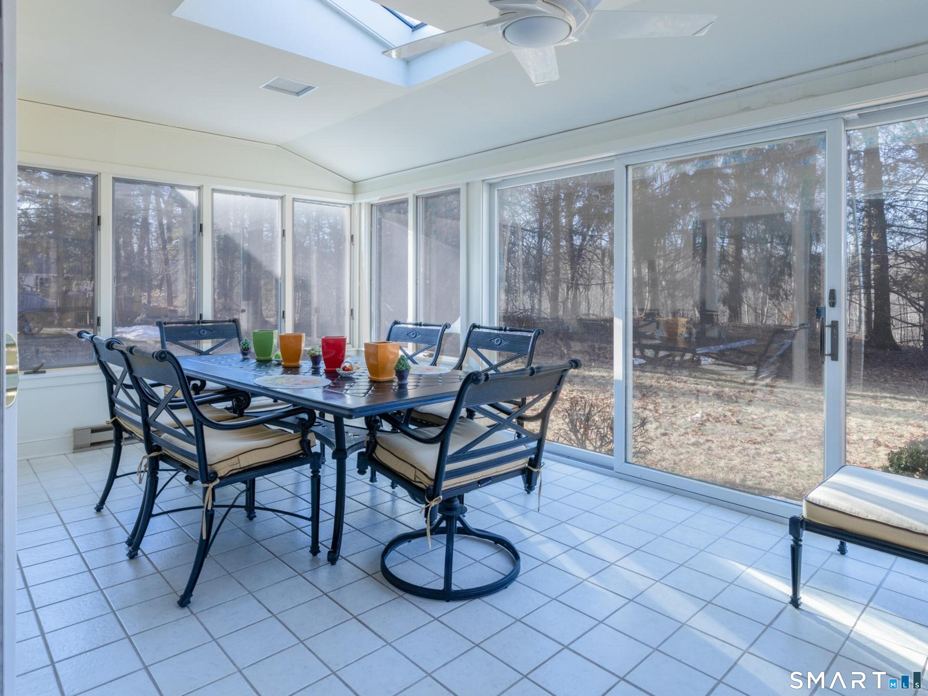 117 Crest Road Middlebury, CT 06762 - Photo 7 of 38 Most charming room in the house. This heated sunroom is the full width of the living room and can be used year round if you so choose. It overlooks the level back yard area and into the woods toward the Crest Rd. Preserve.