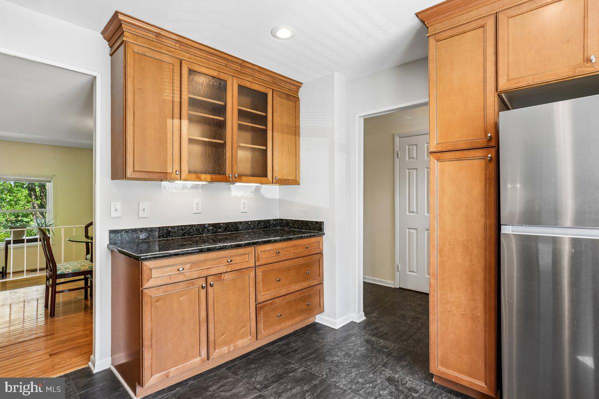 76 Timber Rock Road Gaithersburg, MD 20878 - Photo 17 of 51 a kitchen with stainless steel appliances granite countertop a refrigerator and a stove